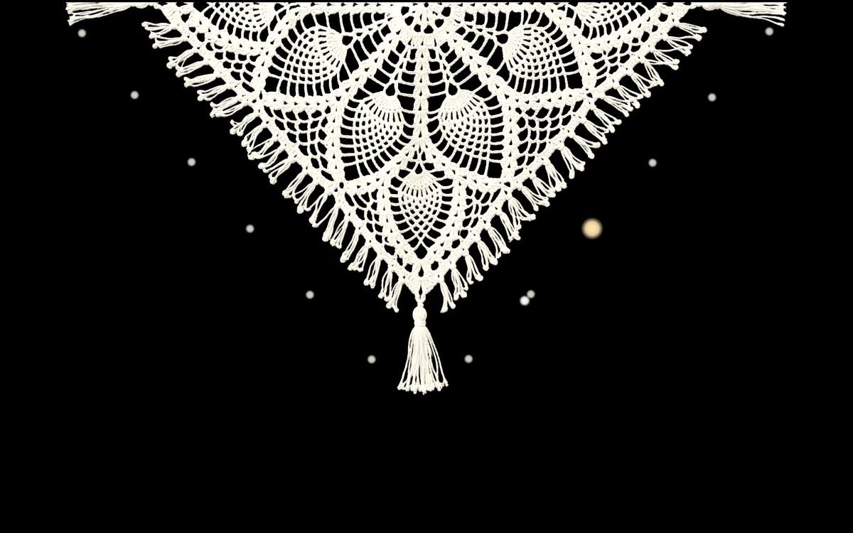 Pineapple lace with a knotted fringe hanging from the top of the screen